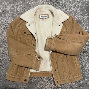 Marvin Richard’s tan sherpa lined corduroy jacket